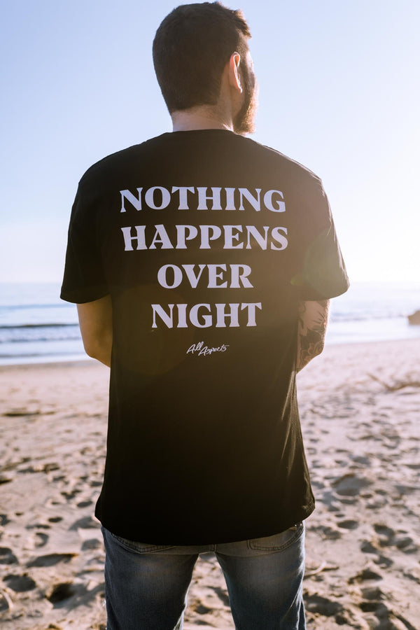 Nothing Happens Overnight Tee - Black